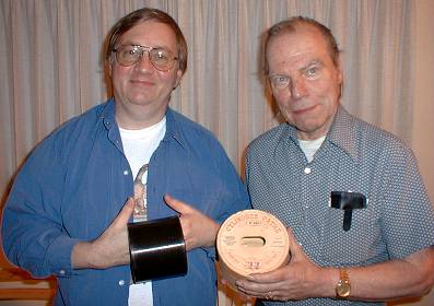 Nathan Davis and Art Guenther (left-to-right) displaying Nathan's Pathe 5-inch molded concert cylinder and carton.