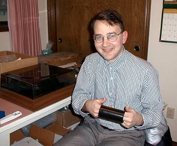 Tyrone Settlemier holding a sneez-o-phone recording.